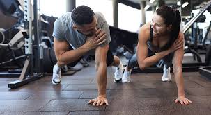 Toning Bingo Wings: Your Ultimate Guide to Sculpting Sleek Arms at the Gym 3 Fitness trainer demonstrating arm toning exercises Kingswinford